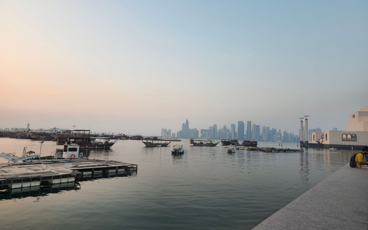 The Doha skyline at sunset, seen from the waterfront