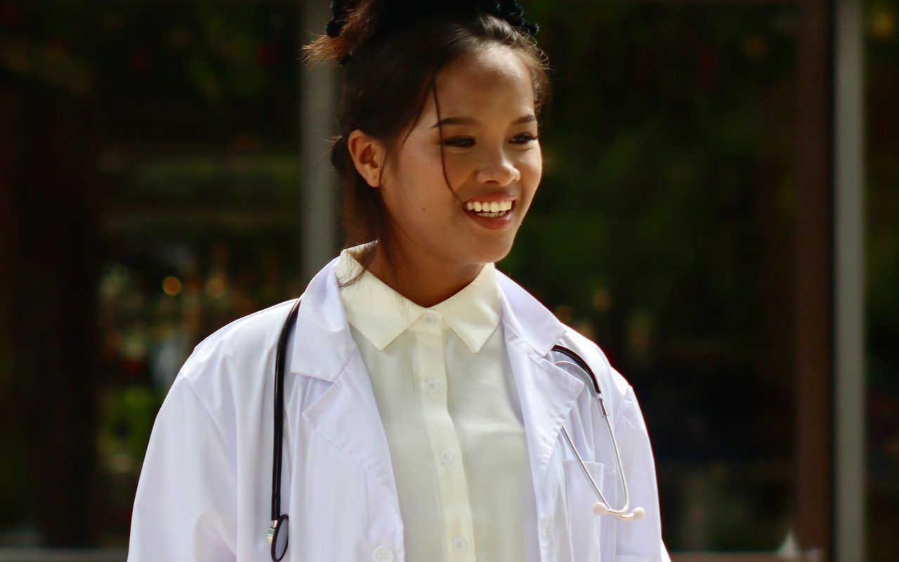 A smiling doctor in a white coat in Davao City, Philippines