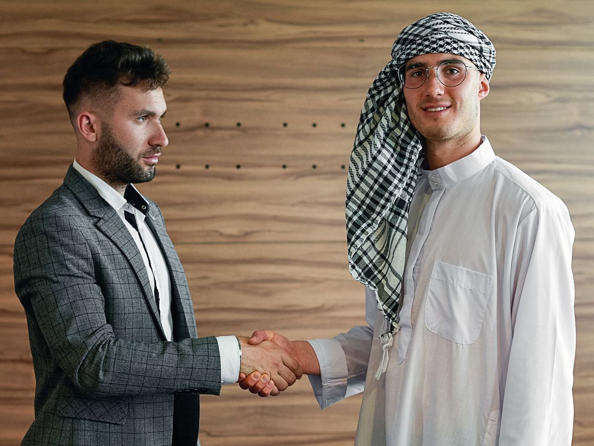 Two men shaking hands in an office